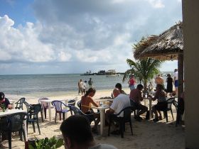 people eating at outdoor restaurants by the beach in Belize – Best Places In The World To Retire – International Living